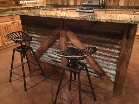 Rustic kitchen island. Barn style island. Tractor seat bar stools. Farmhouse Style Bar Stools, Dapur Rustic, Bar Deco, Espresso Kitchen Cabinets, Farmhouse Bar Stools, Rustic Furniture Design, Western Kitchen, Bar Stools Kitchen Island, Rustic Kitchen Cabinets