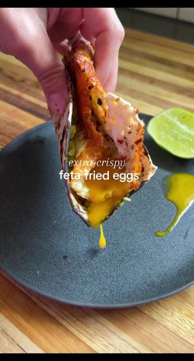 Crispy Feta Fried Eggs, Feta Cheese Fried Egg, Fried Egg Wrap Recipes, Chili Oil And Feta Fried Egg, Feta And Egg Breakfast, Feta Egg Taco, Feta Cheese And Eggs, Feta Egg Toast, Fried Egg With Feta