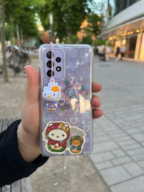 hello kitty and purple samsung Phone Obsession, Samsung Gadgets, Clear Phone Case Design, Kpop Phone Cases, Capas Samsung, Vintage Phone Case, Purple Cases, Earbuds Case, Iphone Wallpaper Kawaii