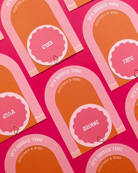 Another peek at the new suite in the house collection: It’s called Cuddles In The Kitchen, and these menu and placecard stacks are off to be part of a colourful shoot. Can’t wait to see them in situ in a pretty tablescape 🧡 ___ Image is of arched dinner menus, with a smaller arch wine and cocktail menu and a circle placecard held together with a gold clip. The font is funky and the colours are deep orange and various dusty pinks. • • • #weddingmenu #weddingcocktails #cocktailhour #weddingta... Orange And Pink Table Decor, Orange Pink Wedding, Cuddles In The Kitchen, Galentines Brunch, Pink Table Decorations, Midsummer Wedding, 21 Dinner, Orange Cocktails, Wedding Name Cards