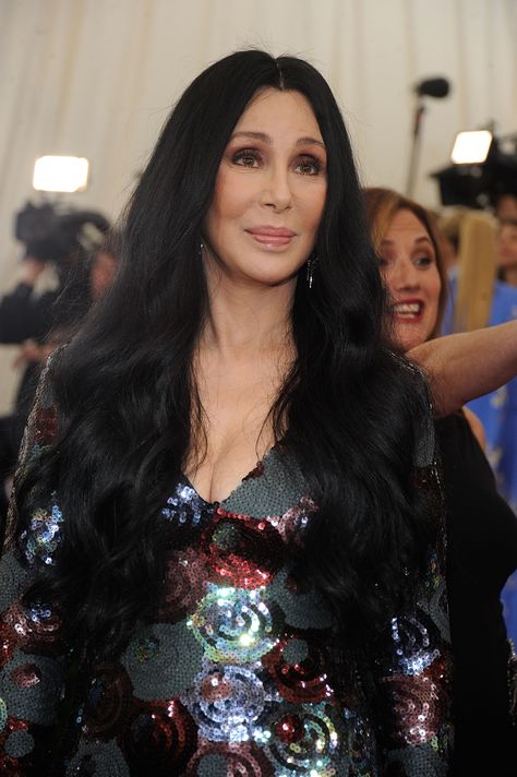 At almost 69 (her birthday is May 20!), Cher stepped out looking gorgeous at the 2015 Met Ball. And as always, she turned heads with her hair, which was long and wavy and fell down to her waist.  - GoodHousekeeping.com Cher Movies, Super Blonde Hair, Cher 80s, Cher Hair, Cher Costume, Long Layers With Bangs, Iconic Hairstyles, Cher Outfits, Edgy Short Haircuts