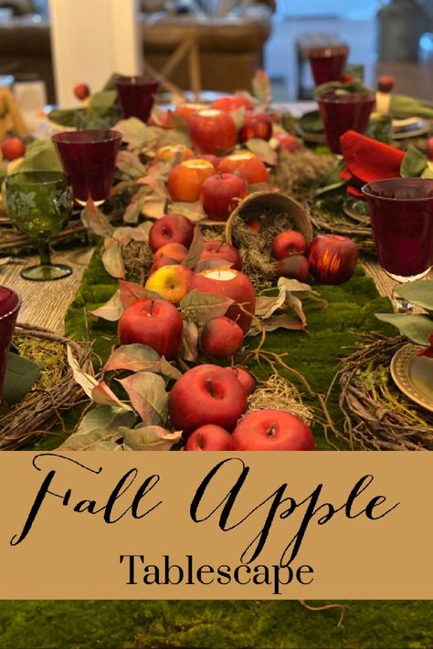 A welcoming tablescape with a rustic feel of apples falling in the orchard. Apple Orchard Decor, Fall Apple Tablescape, Apple Tablescapes, Apple Party Decorations, Apple Table Decorations, Apple Tablescape, Moss Runner, Apple Centerpieces, Apple Table