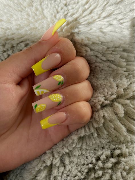 Beautiful coffin style lemon nails with yellow french tip Lemon Inspired Nails, Long Holiday Nails Summer, Lemon Acrylic Nails, Yellow Acrylic Nails Coffin With Design, Citron Nails, Yellow Nails Inspo Aesthetic, Nails Lemon, Yellow Aesthetic Nail Designs, Lemon French Nails