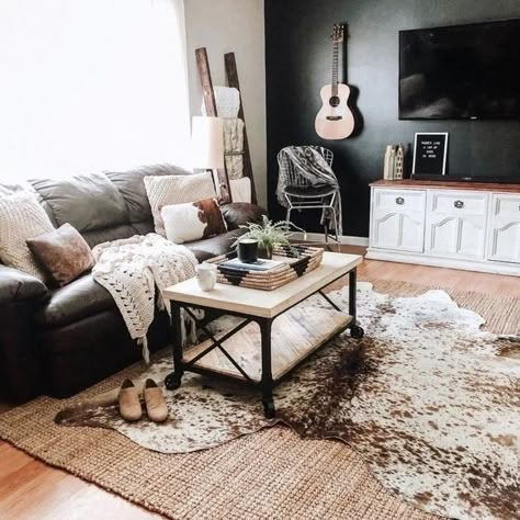 A rug above the rest where a layered cowhide takes center stage, adding depth and dimension to the living room's rustic-chic vibe, and tying together the entire space with its earthy tones and organic texture Explore variety of natural cowhides at our store🛍 Ebay: www.ebay.com/str/storeera 🛒 Etsy: www.etsy.com/shop/storeera 🛒 🔗Link in bio #cowhiderug #cowprint #arearug #interiordesign #diyrug #cowhide #cow #braziliancowhide #genuinerug #interiordesign #interiordesignideas #floorrug #inter... Layered Rugs Living Room, Cowhide Living Room, Cowhide Rug Living Room, Western Living Room, Blanket Rack, Living Room Farmhouse, Instant Gratification, Not Interested, Cowhide Rug