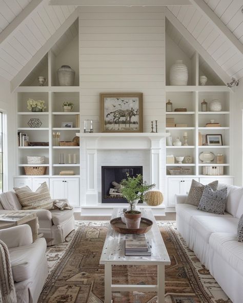 This living room totally captures the modern farmhouse vibe I love! With its vaulted ceilings and shiplap walls, it feels open and airy, but still super cozy. The built-in shelves around the fireplace? Such a great way to add a personal touch with your favorite decor, while keeping everything organized. I’m all about the mix of soft neutrals and textured accents that give the space warmth without feeling cluttered. Plus, with those big windows letting in all that natural light, it’s the perfe... Vaulted Ceiling Living Room Built Ins, Sloped Living Room Ceiling, Vaulted Ceiling Shelves, Family Room Vaulted Ceiling, White Walls With Brown Trim, Shiplap Vaulted Ceiling Living Room, Built In Shelves Living Room Vaulted Ceiling, Fireplace With Tall Ceilings, High Vaulted Ceilings Living Room