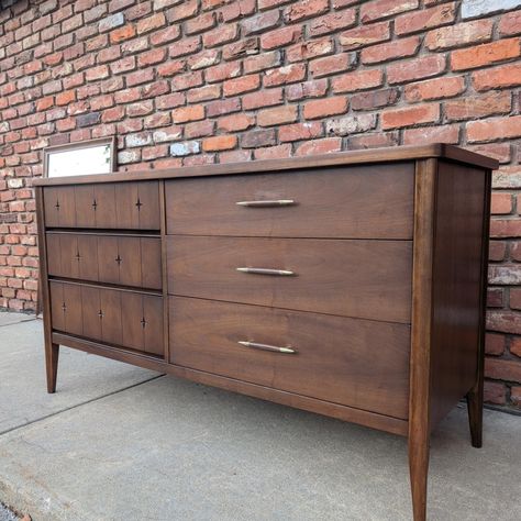 SOLD! ✨ Available at A Little More Like Home, 3801 Dodge St, Omaha, NE open Fridays and Saturdays 1 pm to 4:30 pm, or by appointment. Also available online at www.alittlemorelikehome.shop You'll be seeing stars with this Broyhill "Saga" dresser set! This design by Broyhill features star shaped indents along the top drawers of the tallboy and the right drawers of the lowboy, and even in the glass of the mirror that accompanies the lowboy dresser! The dressers also have pulls with brass tips.... Broyhill Saga, Lowboy Dresser, Dresser Set, Dresser Sets, Top Drawer, Dresser With Mirror, Star Shape, Dodge, Dresser