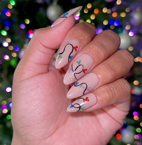 Posted by Zoe Scott: Welcome, sn this post, we're exploring 20 captivating Christmas Lights Nail Designs for this holiday season, perfect for adding festive flair to your ... Save For Disney, Holiday Nail Inspo, Disney Christmas Nails, Disney Inspired Nails, Christmas Tree Nails, Candy Cane Nails, Christmas Gel, Red Christmas Nails, Tree Nails