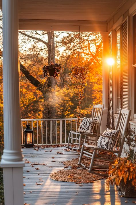 Cozy Fall porch decor with rocking chairs, cushions, hanging plants, and a lantern, bathed in autumn sunlight. Perfect for Fall front porch decor. Fall Decor For Outside, Creating Curb Appeal, Front Porch Ideas For Fall, Porch Ideas For Fall, Rustic Arrangements, Vintage Fall Decor, Fall Front Porch, Seasonal Decorations, Front Porch Ideas