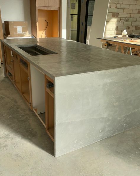 Few pics of the kitchen we did for a house in Nashville. We rarely do pour in place but this island was so large with double waterfall ends we decided it was to best route for this project. #concretecountertops #gfrc #concreteart #concreteartisan #concretefurniture #concretesink #coffeetable #modernkitchen #countertops #customsink #concretecoffeetable #concretevanity #concrete #concretecoffeetable #concretetable #concretediningtable #concretetable #furniture #kansascity #interiordesign #na... Unique Concrete Countertops, Thick Granite Countertops, Waterfall Concrete Countertops, Cement Kitchen Island, Concrete Worktop Kitchen, Cement Countertops Kitchen, Concrete Waterfall Countertop, White Concrete Countertops Kitchen, Concrete Countertop Colors