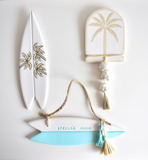 Pictured here is a Medium Dusty Olive Palm Trio Surfboard, Small Dusty Olive Island Palm and Tiffany Blue Surfboard Sign 🥰❤️🌴 #nurseryart #nurseryideas #nurserydecoration #namesign #namesigns #nameplates #nameplaques #birthplaque #birthannouncement #oceanchild #beachkids #beachkids #boysroomdecor #boysroomart #girlsroomstyling #girlsroomdecor #babygirlnursery #babyboy #babyboynursery #girlsnames #girlsbirthday #boysbirthday #babyshowergift #babyshowerdecor #babyshowertheme #babyshowergifts #su Blue Surfboard, Surfer Decor, Surfboard Sign, Boy’s Room, Clay Diy Projects, Girl’s Room, Boys Room Decor, Girls Room Decor, Tiffany Blue