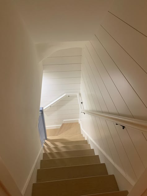 White Shiplap staircase will brighten up a basement. Staircase Design Basement, Shiplap Basement Stairwell, Shiplap Basement Walls, Basement Handrail, Shiplap Staircase Wall, Shiplap Basement, Beach House Staircase, Shiplap Stairwell, Shiplap Staircase