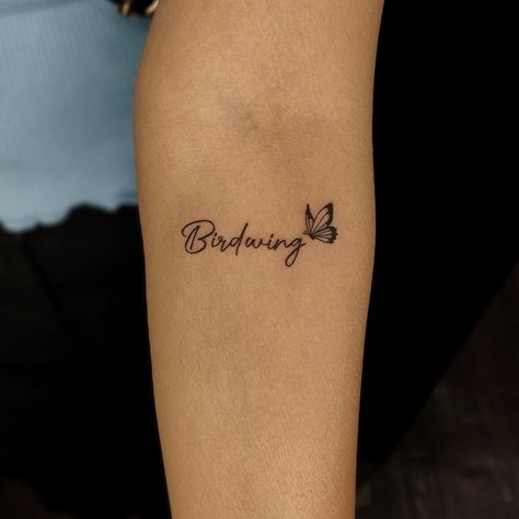 Word With Butterfly Tattoo, Butterfly Neck Tattoo With Name, Name With Butterfly Tattoo Design, Small Butterfly Tattoo With Name, Butterfly Script Tattoo, Butterfly With Script Tattoo, Name With Butterfly Tattoos For Women, Handwriting Tattoo With Butterfly, Tiny Butterfly Tattoos For Women