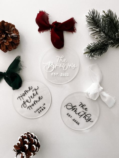 Thank you for Stopping By Signatures By Sidney! These Personalized Acrylic Ornaments will make for the perfect addition to your home this Christmas Season.  I carefully hand letter the on each tag with a permanent Paint Pen to ensure quality and durability. These are available in a variety of different color options as well as ribbon colors.  Each Ornament has a painted back unless you choose the color 'clear'.  Happy Holiday Shopping! Unique Christmas Ornaments Cricut, Easy Cricut Gifts For Christmas, Shop Small Christmas Graphic, Personalized Cricut Crafts, Unique Cricut Christmas Gifts, Cricut Projects Personalized, Diy Christmas Gift Cricut, Personalize Christmas Ornaments, Homemade Acrylic Ornaments