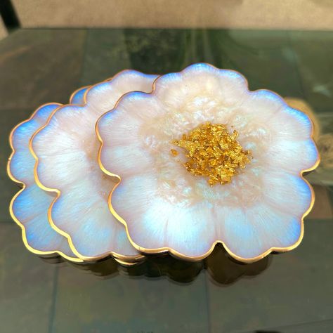 "Iridescent White Opal" Handmade Resin Flower Coasters These coasters are perfect for housewarming gifts, personal gifts, bridesmaid gifts or for those just wanting extra decor in their home  𝐃𝐄𝐓𝐀𝐈𝐋𝐒: These adorable one of a kind white opal inspired and gold flower shaped coasters are 100% handmade by me in my home. Each coaster is made with high quality epoxy resin, iridescent white non-toxic cruelty-free mica powder that reflects a blue-purple-green sheen, gold flakes in the center and Coaster Gift Ideas, Resin Words, Iridescent Decor House, Diy Coasters Resin, Floral Resin Art, Cute Etsy Finds, Coaster Inspiration, Resin Flower Coasters, Resin Gifts