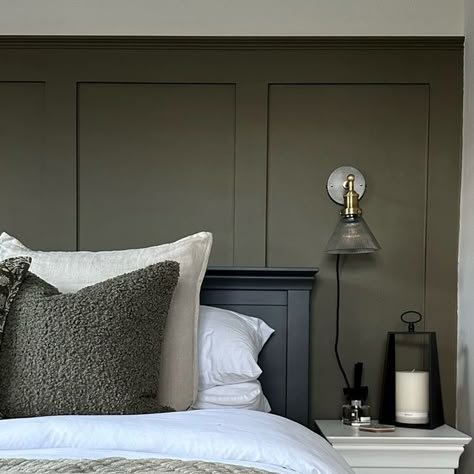 Courtney  |  Home interiors & renovations on Instagram: "New interior obsession for 2024… dark moody paint colours🖤  Where froms: • Panelling colour - colour match to F&B Cardamom (RAL 0954010) • Panelling colour - F&B Ammonite (colour matched by @decoratingcentreonline ) • Bed - @cotswoldco  • Wall lights - @industville  • Cushions - @dunelmuk (beige) @tkmaxxuk (green boucle) @vincentdaviesdepartmentstore (green pattern) • Throws - @hmhome (green) @dusk.com (beige) • Rug - @homesense_uk  • Lantern - old @bm_stores" Dark Green Panelled Wall, Green Feature Wall Bedroom Ideas, Dark Panel Bedroom, F&b Setting Plaster, Dark Bedroom Panelling, Dark Panelling Bedroom, Olive Green Panelling, Dark Green Panelling Bedroom, Dark Colour Bedroom Ideas