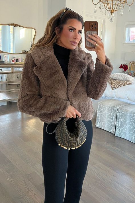 Say goodbye to boring outfits and hello to winter chic style! For this stunning brown faux fur coat outfit, simply pair your coat with a timeless black bodysuit, casual leggings, and some stylish accessories. A cozy and sophisticated ensemble that will make you look stunning at any event, perfect for the holiday season. Shop it now and get ready to rock it all winter long! Emily Ann Gemma. Faux Fur Coat Outfit Crop Faux Fur Jacket Outfit, Brown Fur Jacket Outfit, Brown Faux Fur Coat Outfit, Brown Fur Coat Outfit, Faux Fur Coat Outfit, Faux Fur Coats Outfit, Fur Jacket Outfit, Emily Ann Gemma, Boring Outfits