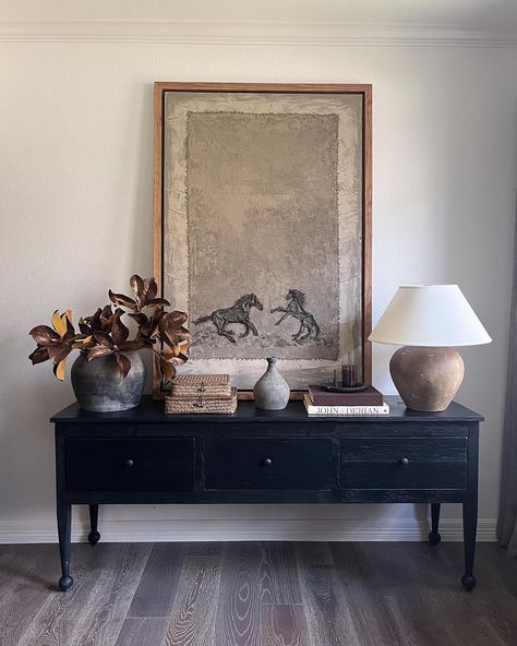 You guys - how stunning is my new piece of art by my talented friend @christiannetaylor ?! I'm trying to decide if it should go here or in my living room but I feel like it's absolutely perfect on this console table. I've linked everything else in my LTK. https://ltk.app.link/aBlyN1GZPMb #consoletabledecor #homedecor #ltkhome #interiordesign #oilpainting #afloral #oliveateliers Console Table Picture Wall, Small Cabinet Decor Living Room, Entry Console Table Art, Large Entryway Artwork, Leaning Art On Console, Console Table Styling Dining Room, Tv Console Wall Decor, Tv Console Traditional, Large Mirror Console Table