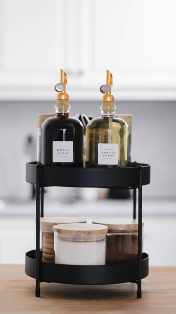 Rose | No.66 on Instagram: "Updated my coffee corner! What do you think? 🤩🫶🏼✨ #coffeecorner #coffeebar #restock #restocking #refill #organizing #organizedhome #satisfying #asmr #foryou" Coffee Container Ideas Storage, Coffee Countertop Ideas, Coffee Corner Ideas Small Spaces Counter Tops, Black Coffee Bar Ideas, Kaffe Station, Coffee Corners, Coffee Bar Ideas Kitchen Counter, Coffee Bar Cart, Buffet Stand