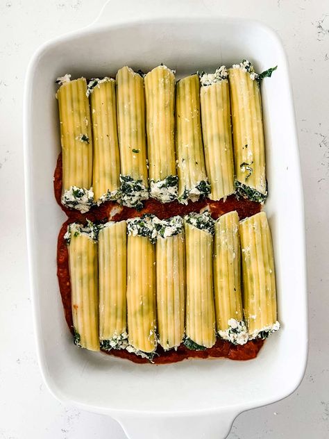 Craving something comforting and delicious? Look no further than this classic chicken-spinach manicotti! Our recipe combines tender chicken, spinach, and cheese-stuffed manicotti noodles all cooked in a rich tomato sauce for a meal that is sure to satisfy everyone. With its creamy texture and hearty flavors, it's the perfect dish for a cozy weeknight dinner or special family gathering. So, turn on the oven and get ready to enjoy this delicious Italian classic - your taste buds won't regret it! Chicken Manicotti Recipe Easy, Manicotti With Cottage Cheese, Chicken Spinach Manicotti, Chicken Stuffed Manicotti, Manicotti Crepe Recipe, Chicken Manicotti Recipe, Spinach Manicotti Recipe, Chicken Spinach Ricotta, Manicotti Crepes