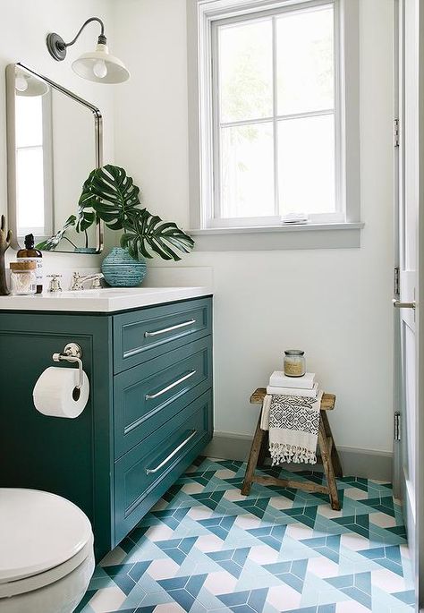 Lit by a white vintage barn gooseneck sconce, a Restoration Hardware Bristol Mirror is hung above a peacock blue washstand donning long nickel pulls and a white quartz countertop fitted with a sink with a polished nickel faucet. Kate Lester Interiors, Teal Bathroom Decor, House Bathroom Designs, Hart House, Beautiful Tiles, Beach House Bathroom, Teal Bathroom, Patterned Floor Tiles, Bathroom Decor Ideas