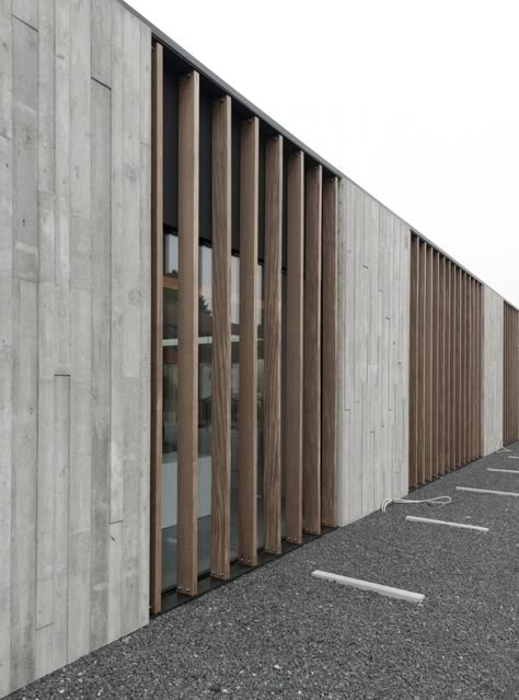 The use of timber formwork translates through to the vertical solar shading... Wood Facade, Facade Material, Concrete Facade, Concrete Architecture, Wood Architecture, Concrete Building, Timber Cladding, Concrete Wood, Building Facade