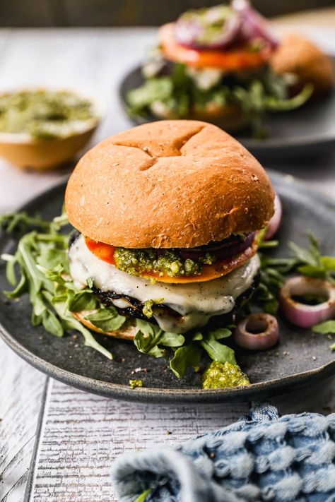 BEST Portobello Mushroom Burger! An easy balsamic marinade adds incredible flavor. Stuffed with cheese and served on a fluffy brioche bun. Even meat lovers cannot resist! Serve grilled or cook on the stove or in the oven. #wellplated #vegetarian #healthy #portobello Portabella Mushroom Burger, Caprese Burger, Oven Burgers, Mushroom Burger Recipe, Portobello Mushroom Burger, Portobello Burger, Balsamic Marinade, Grilled Portobello, Bbq Chicken Crockpot