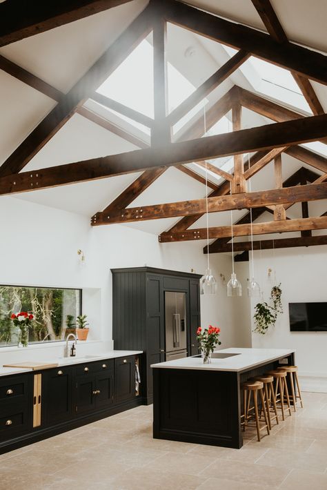 A beautiful dark painted shaker kitchen in this barn conversion with original beams. The stone floor is inkeeping with the style of the barn and works well. From the home of @barn.renovation on Instagram. Tom Howley Kitchen, Barn Conversion Kitchen, Barn Interior Design, Butler Kitchen, Converted Barn Homes, Tom Howley Kitchens, Barn Conversion Interiors, Tom Howley, Barn House Interior