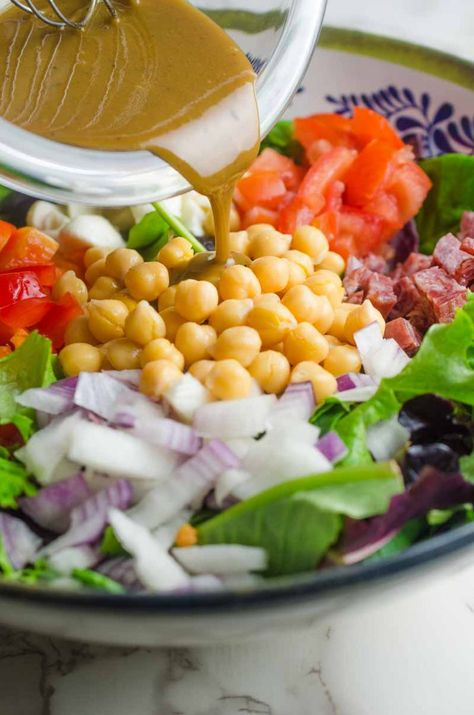 Italian chopped salad LOADED with salami, mozzarella and veggies all tossed in a tangy balsamic dijon vinaigrette. Chopped Salad Recipe, Chopped Salad Recipes, Italian Chopped Salad, Dijon Vinaigrette, Paleo Salads, Italian Salad, Dinner Recipes Easy Quick, Tomato Pasta, Chopped Salad