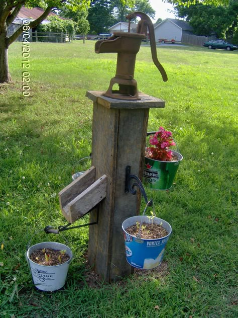 Old well pump, barn wood and beer buckets! Ideas To Hide Septic Tank Covers, Old Water Pump Ideas, Water Pump Ideas, Well Pump Cover Ideas, Beer Buckets, Well Pump Cover, Old Water Pumps, Well Covers, Beer Decor