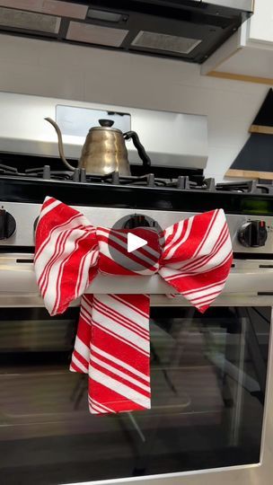 383K views · 589 reactions | Christmas dish towel bow! | Christmas dish towel bow!

This original video was produced by Network Media, Life with Coco, and Leon & LaCongo | By Life with Coco | This is so easy. Take a kitchen
towel, fold it into thirds, and then thirds the other way. Take
another kitchen towel of the same pattern and fold it into
one long piece. Combine the two, scrunch it up, and feed it
through your stove handle. And look at how adorable this is. Life With Coco, Bow Christmas, Christmas Dishes, Original Video, Christmas Bows, Kitchen Towel, Dish Towels, A Kitchen, The Two