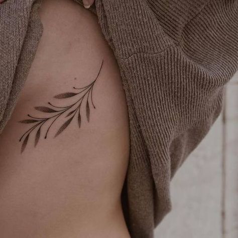 Olive Branch Tattoo Ribcage, Cute Small Nature Tattoos, Rib Cage Vine Tattoo, Olive Tree Leaves Tattoo, Olive Branch Tattoo Ribs, Leaf Tattoo Ribs, Hip Leaves Tattoo, Leaves Tattoo Back, Vine Ribcage Tattoo