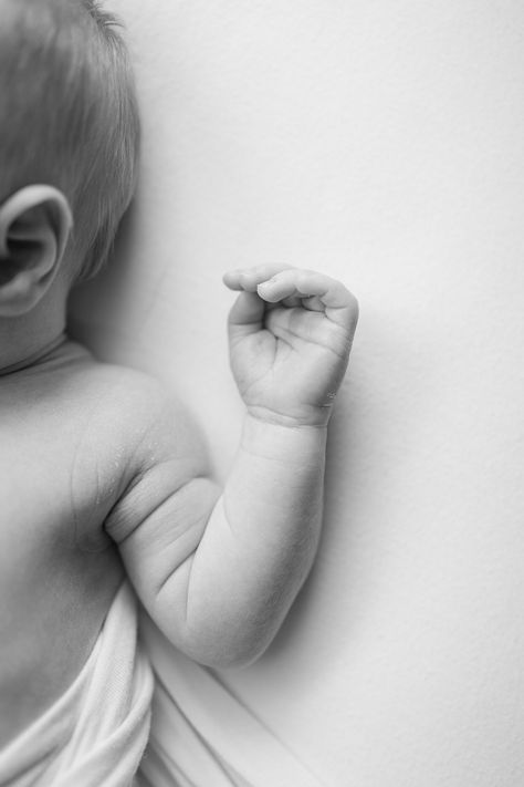 black and white close up image of newborn baby. boy's hand and arm during newborn photos Newborn Room Photography, Newborn Photography Must Haves, Newborn Photos Not Showing Face, Newborn Photography No Face, Private Birth Announcement Photos, Neutral Newborn Photos, Creative Baby Photoshoot Ideas At Home, Private Newborn Photos, Faceless Newborn Photos