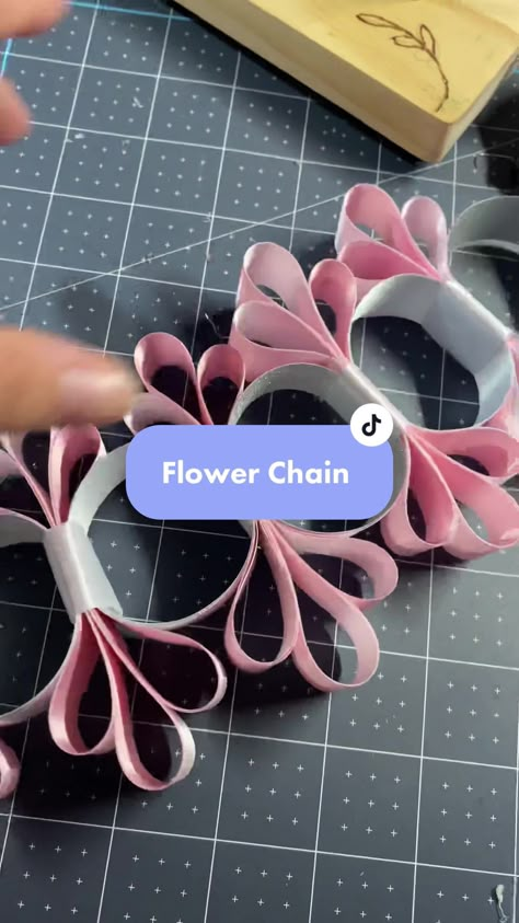 The flower power chain is cute, but definitely a little time consuming... | Chain | TikTok Mini Homecoming Mums Diy, Homecoming Chains Diy, Homecoming Ribbons Diy, Diy Homecoming Mums, How To Make A Loop Chain Mum, Western Mums Homecoming, Small Homecoming Garter, Hoco Mums Ideas, Homecoming Mums Ideas Unique