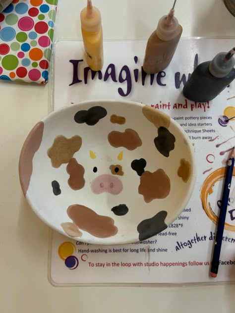 Pottery Painting Faces, Pottery Painting Ideas Square Plates, Strawberry Cow Pottery, Paint A Pot Bowl Ideas, Cow Pottery Painting Ideas, Painting On Clay Pottery, Fun Plate Designs, Pottery Painting Ideas Beginners, Color Me Mine Designs