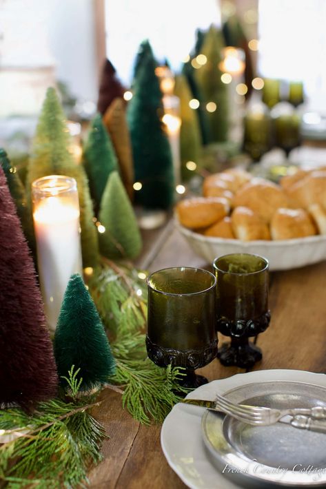 Green Tablecloth Christmas Decor, Bottle Brush Tree Tablescape, Christmas Table Settings Green Tablecloth, Green Goblet Table Setting, Green Christmas Tablecloth, Bottle Brush Tree Tea Cup, Cottage Core Christmas, French Country Cottage Christmas, Vintage Party Theme