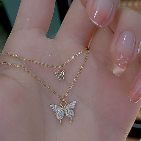 This beautiful necklace features a delicate double layer design with two butterfly pendants. It's perfect for adding a touch of whimsy and sophistication to your look. https://belsizecrafts.com/products/double-layer-butterfly-pendant-necklace #UKJewelry #UKFashion #BritishMade #UKSmallBusiness #SupportSmallBusiness #ButterflyNecklace #DoubleLayerNecklace #PendantNecklace #FashionNecklace #GiftForHer Teardrop Diamond Necklace, Minimalist Diamond Necklace, Simple Pearl Necklace, Teardrop Diamond, Custom Initial Necklace, Outfit Classy, Simple Pearl, Butterfly Pendant Necklace, Neck Jewellery