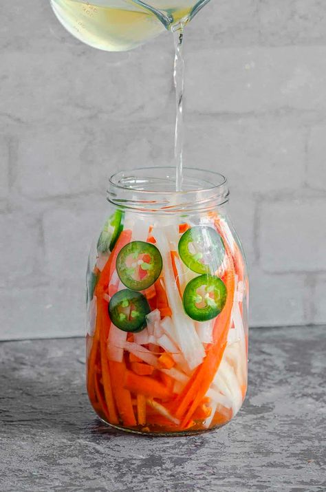 Tangy, savory and crunchy this pickled daikon radish recipe is quick, easy to make and everything you are looking for in a pickled vegetable. Korean Radish Recipes, Pickled Daikon, Radish Pickles Quick, Radish Pickle Recipe, Pickled Daikon And Carrots, Pickled Daikon Radish Recipes, Daikon Radish Recipes, Pickled Diakon Radish And Carrot, Quick Pickled Radish