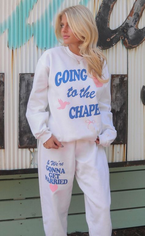 Preorder tees and sweatshirts ship out within 2-12 business days and preorder hats can take up to 15 business days to ship. Goin' to the chapel and we're gonna get ma-a-arried. These bridal white sweatpants are the perfect gift for your girl who just got engaged, a bachelorette gift or something to throw on for the big day! We love the bright pop of "something blue." Oh, and don't forget the matching sweatshirt ;) Mary Claire is 5'9" and is wearing size medium Maggie is 5'3" and is wearing size Going To The Chapel, Just Got Engaged, Scarf Coverup, Retro Heart, White Sweatpants, Bachelorette Gift, Bachelorette Outfits, Got Engaged, Matching Sweatshirts