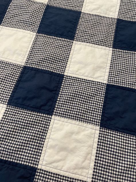 A handmade baby quilt in a mix of navy, white and navy gingham. The backing is a navy and white abstract square print.  This quilt is cut, pieced, machine quilted and machine bound by me. This quilt is a collection of 100% cotton fabrics. Minor variations may occur as handcrafted products are unique and one of a kind. Colors of fabrics may appear differently to you, due to your individual computer screen resolution.  My quilts have 3 layers: top, middle and back.  The top layer is pieced 100% co Quilt Patterns Twin Size, Red Patchwork Quilt, Gingham Patchwork Quilt, Simple Blanket Sewing, Simple Christmas Quilt, Simple Quilts For Beginners, 9 Square Quilt Patterns, Baby Blanket Quilt Pattern, Monochromatic Quilt Patterns