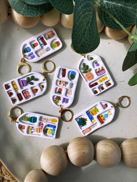 Mediterranean themed bookshelf earrings! These are perfect for any book lover. Unique, special and aesthetically pleasing, you'll get all the compliments wearing these!  These earrings come in 3 different styles. Earring hooks are nickel free silver, and studs are stainless steel. Huggies pictured are stainless steel, but can be swapped out for hooks or ball studs if requested. Earring Care: - Avoid contact with makeup or alcohol - Store in a cool, dry place - Keep dry (don't wear in the shower or swimming) - Clean with a damp cloth if needed - Be gentle with them! I try to make them as durable as possible, and polymer clay can be quite sturdy, but they aren't indestructible.  Disclaimer: All earrings are individually handmade by me. There may be some slight differences between them, some Mediterranean Bookshelf, Polymer Clay Bookshelf, Polymer Clay Trinkets, Bookshelf Boho, Cool Clay Ideas, Bookshelf Earrings, Themed Bookshelf, Boho Bookshelf, Polymer Clay Decor