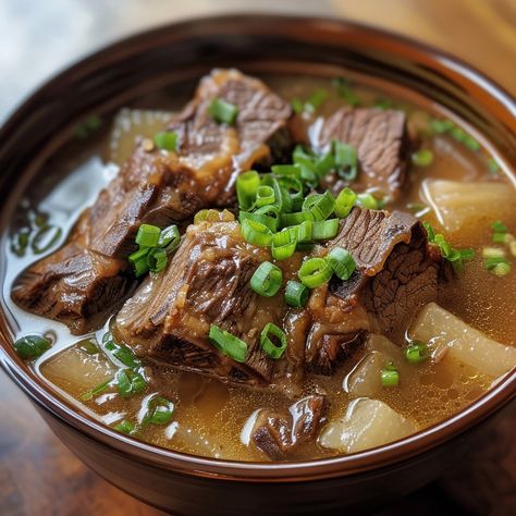 🍲 Warm up with the rich and hearty Galbitang! 🥩✨ #BeefRibSoup #KoreanComfort Galbitang (Beef Rib Soup) Ingredients: Beef short ribs (1 lb) Water (8 cups) Radish, sliced (1 cup) Garlic, crushed (4 cloves) Onion, chopped (1) Soy sauce (2 tbsp) Salt and pepper to taste Green onions, chopped (for garnish) Instructions: Boil beef short ribs in water, then discard the water to remove impurities. In a clean pot, add ribs, 8 cups of water, radish, garlic, and onion. Simmer for 1-2 hours until rib... Beef Rib Soup, Rib Soup, Boiled Beef, Beef Rib, Korean Soup, Soup Ingredients, Instagram Recipes, Twisted Recipes, Food Babe