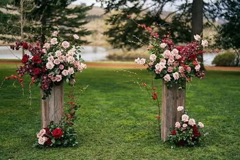 Wooden Plinths Wedding, Meadow Arrangement Ceremony, Wooden Flower Pedestal, Alter Flowers On Ground, Flower Stand Wedding Ceremony, Pillar Floral Arrangements, Wedding Alter Flowers Pillars, Plinth Wedding Ceremony, Wedding Plinths Ceremony