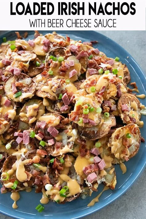 Loaded Irish Nachos start with a pile of crispy, sliced, seasoned potatoes!  Then we load them with corned beef, bacon, and a mouthwatering beer cheese sauce! Irish Nachos, Nachos Recipe Beef, Beer Cheese Sauce, The Salty Marshmallow, Salty Marshmallow, Potato Nachos, Irish Potato, Irish Potatoes, Seasoned Potatoes