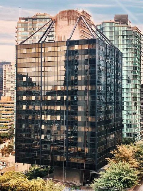 Vancouver’s only suspended building.  Opened in 1969 as the Westcoast Transmission Building, now converted to residential called Qube.  One of only a handful of such structures in the world, it is deemed to be Vancouver’s only earthquake-proof building.     I love this building and I wonder if it could be built today.     Is there a developer or company innovative and risk adverse enough to take such a chance and invest what must have been a considerable premium to build such a unique structure? Architecture History, Structure Architecture, Residential Building, Building Design, West Coast, Vancouver, Skyscraper, Google Images, Multi Story Building