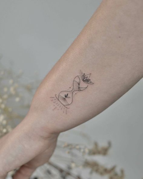 12+ Girly Hourglass Tattoo Ideas To Inspire You! - alexie Tattoos Representing Time, Hourglass Wrist Tattoo, Hourglass Line Tattoo, Hourglass Small Tattoo, Feminine Hourglass Tattoo, Phd Tattoo Ideas, Hour Glass Tattoo Designs For Women, Minimalist Hourglass Tattoo, Tattoo About Time