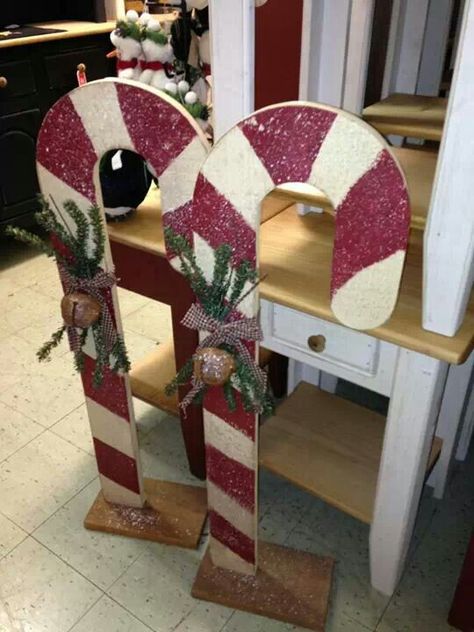 Wood candy canes, Cute idea to line my sidewalk! Wooden Candy Canes Yard Art, Wood Candy Canes Christmas Decorations, Diy Outdoor Wood Christmas Decorations, Wood Candy Cane Diy, Wood Candy Canes, Wood Christmas Ideas, Wooden Candy Canes, Christmas Wood Cutouts, Outdoor Wooden Christmas Decorations