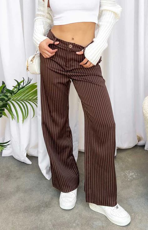 Brown Pinstripe Pants Dress pants are a wardrobe essential when it comes to styling. These brown pinstripe pants are perfect for workwear, going out and everyday! Style with a crop and sneakers to complete this look. Brown Pinstripe Pants, Stripe Pants Outfit, Wide Leg Pants Outfit, Full Length Pants, Brown Pinstripe, Festival Pants, Shop Pants, Striped Wide Leg Pants, Pinstripe Pants