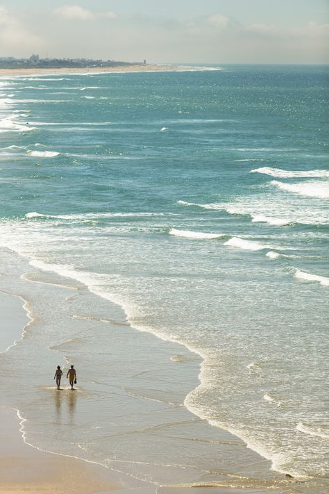 A couple walk on the beach at Conil de la Frontera, in Andalucia. Beach Walk Couple, Walking By The Beach, Ear Acupressure, Couple At The Beach, Dear Girl, Walking Along The Beach, Ear Seeds, Walking Beach, Walks On The Beach