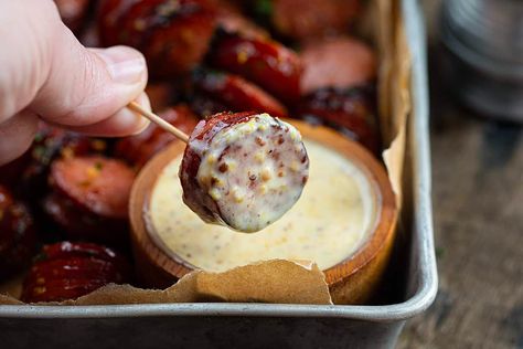 Mustard Hasselback Kielbasa Bites are rings of smoked sausage, sliced hasselback style, and then cut into bite-sized sections and smothered in a mustard-base sauce. Then, the bites are cooked in an air fryer, soaking up all of the flavorful sauce! For serving, the bites are paired with a creamy and tangy mayonnaise-based dip. It's an appetizer that is not only delicious but visually appealing! Oven instructions included! Tangy Mustard Sausage Bites, Mustard Hasselback Kielbasa Bites, Hasselback Kielbasa, Kielbasa Appetizer, Kielbasa Bites, Mustard Dip, Sandwich Sauces, Polish Sausage, Cocktail Party Food