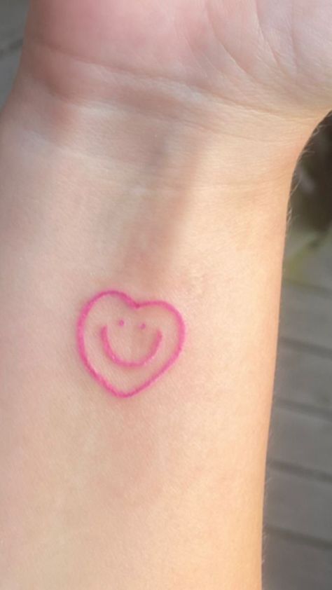 tattoo uploaded by tatiana on We Heart It Smiley Heart Tattoo, Cute Pink Tattoos, Eeaao Tattoos, Pink Tattoo Ideas, Cute Heart Tattoos, Pink Heart Tattoo, Pink Ink Tattoo, Pink Tattoo Ink, Dr Tattoo